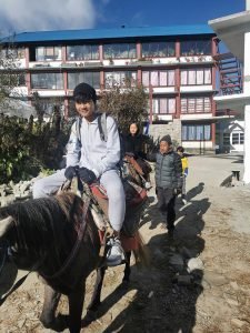 Trekking with Kids in the Annapurna Region: Family Adventure in Nepal 2 kids on horse
